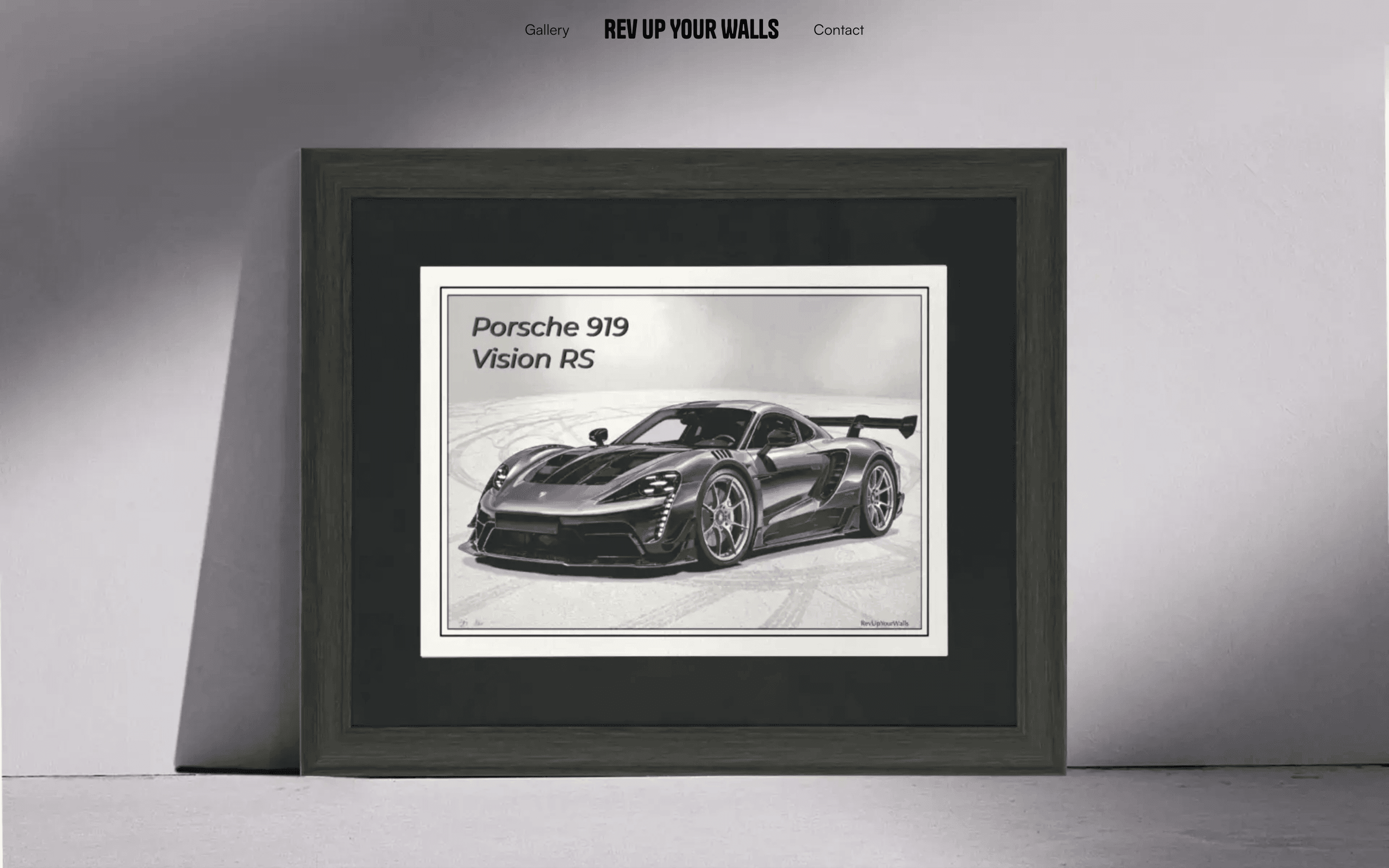 The rev up your walls home page, showing a framed Porsche 919 Vision RS print propped against a wall